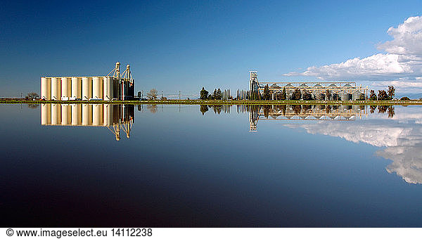 Rice Silos and Flooded Rice Field