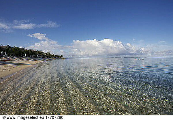 Ripples In The Sand Under The Clear Water On The Coast Of An Island In The Indian Ocean; Mauritius