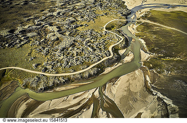 River and road in rough highlands