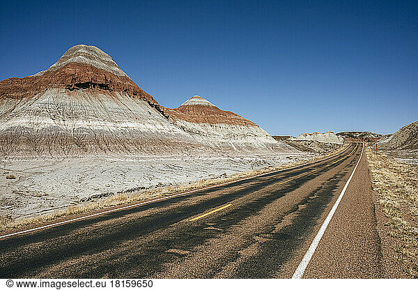 Road passes colorful dirt mounds in Petrified Forest national park