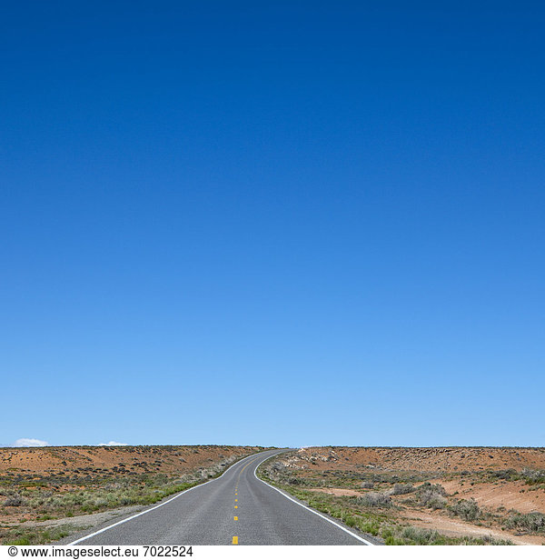 Road Passing Through a Barren Desert Landscape