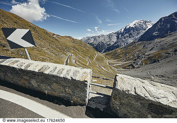 Road sign at Stelvio Pass on sunny day  South Tyrol  Italy