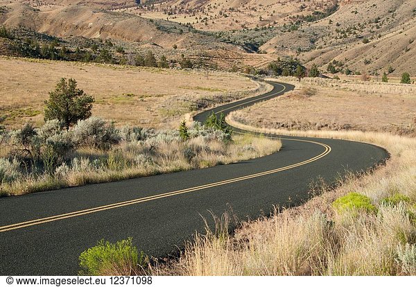 Road through sage grassland  John Day Fossil Beds National Monument-Sheep Rock Unit  Journey through Time National Scenic Byway  Oregon.