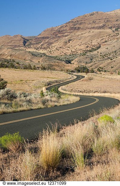 Road through sage grassland  John Day Fossil Beds National Monument-Sheep Rock Unit  Journey through Time National Scenic Byway  Oregon.