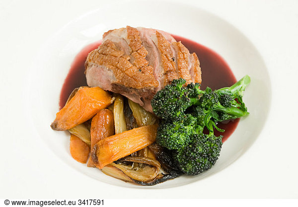Roast duck with vegetables and jus
