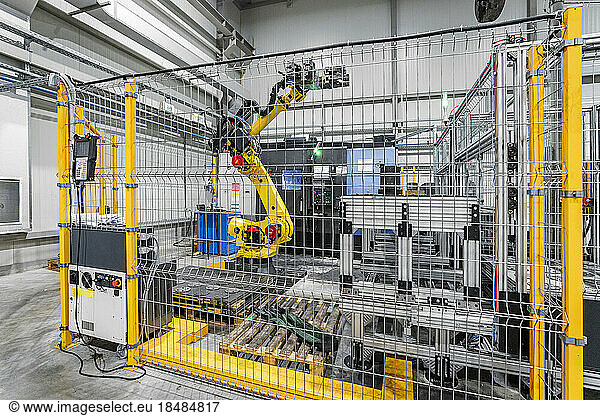 Robotic arm with machinery in industry