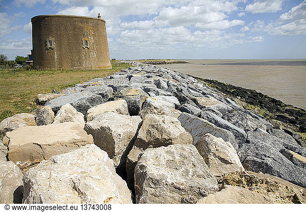 Rock armor coastal defenses protect the Martello tower East Lane  Bawdsey  Suffolk  England