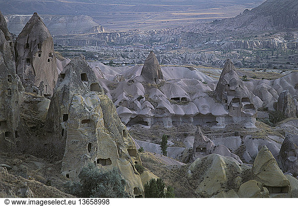Rock dwellings in the volcanic tuffs of Uchisar Village in Cappadocia  Anatolia  Turkey; a World Heritage Site.