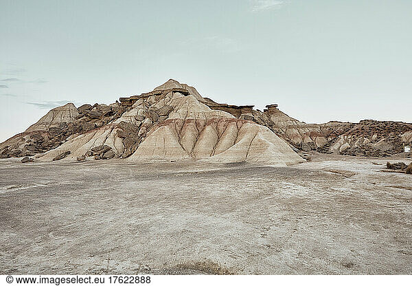 Rock formation under clear sky in desert landscape