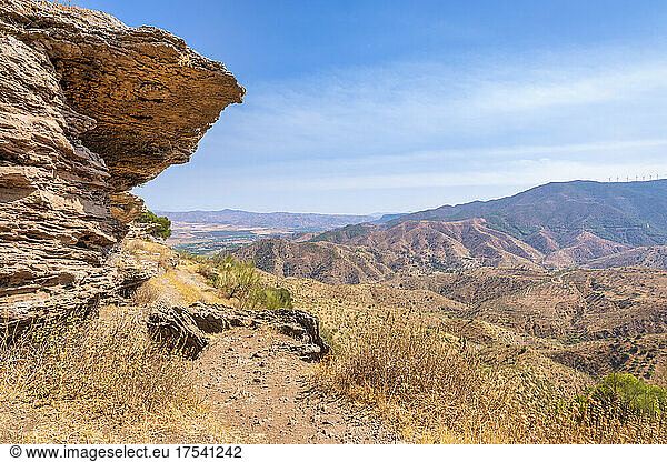 Rock formations at mountain on sunny day  Andalucia  Spain  Europe