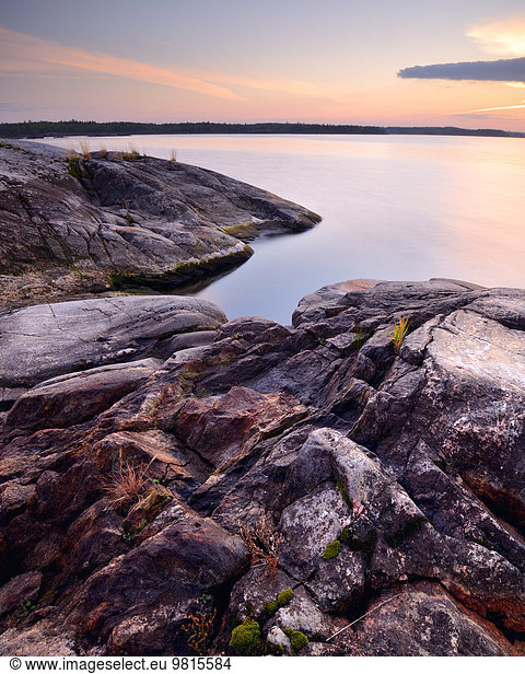 Rocks on Iso Koirasaari Island at sunset  Ladoga Lake  Republic of Karelia  Russia