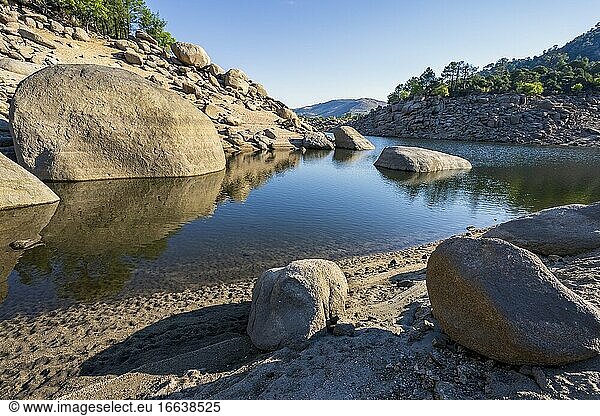 Rocks  pines and drought at Burguillo reervoir. Avila. Spain. Europe.