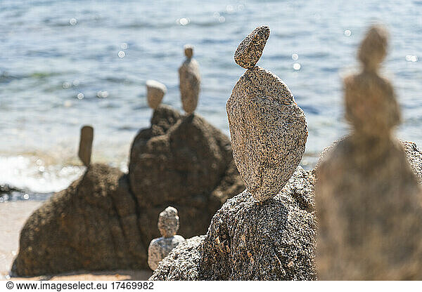 Rocks stacked at beach on sunny day  Lloret De Mar  Catalonia  Spain