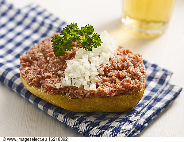 Roll with minced meat and onion  close-up