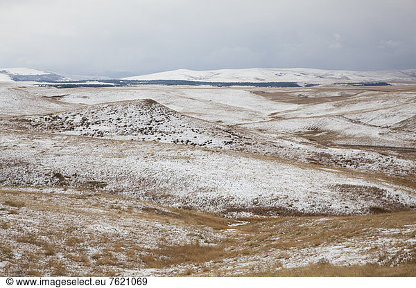Rolling hills in snowy landscape