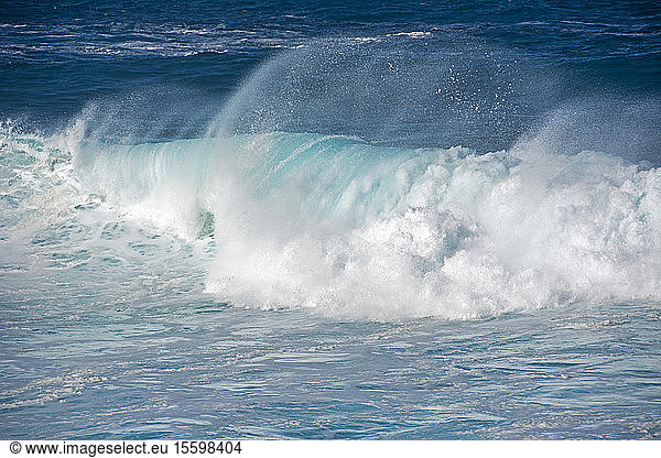 Rolling wave in blue and green water; Easter Island  Chile