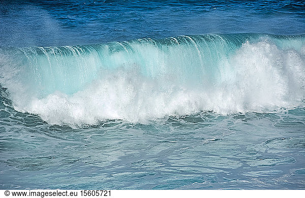 Rolling wave in blue and green water; Easter Island  Chile