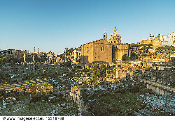 Roman Forum with Santi Luca e Martina  Roman temples in background. Roem  Italy