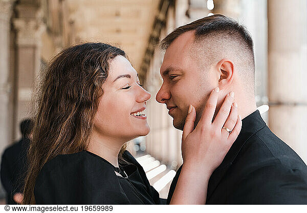 Romantic close-up portrait of lovers in black clothes