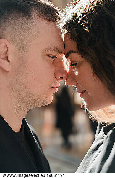 Romantic close-up portrait of lovers in black clothes