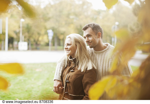 Romantic couple at park during autumn