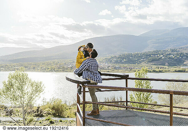 Romantic couple spending leisure time near observation point