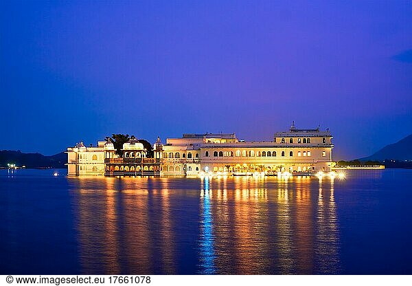 Romantic luxury India travel tourism  Lake Palace (Jag Niwas) complex on Lake Pichola in twilight  Udaipur  Rajasthan  India