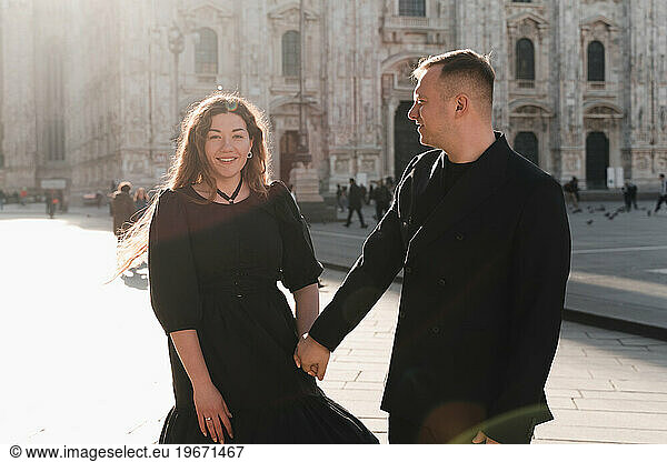 Romantic photo of lovers on the main square of Milan  backlight
