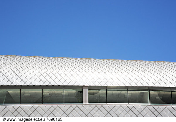 Roof of modern building and blue sky