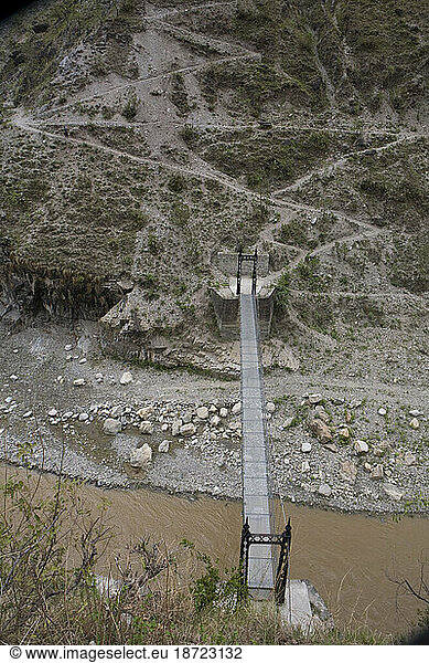 Rosa River with suspension bridge. Kavre  Nepal.