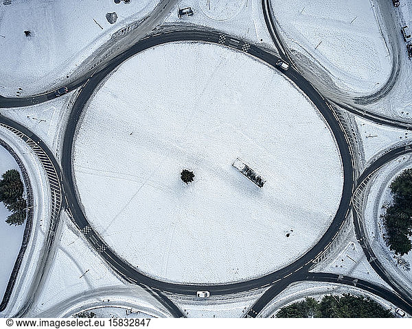 Round road junction in snowy countryside