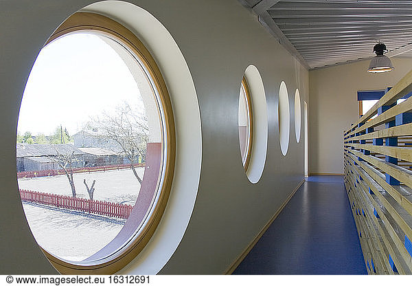 Round Windows in a school corridor.