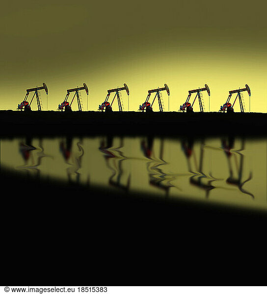 Row of oil pumps at dusk