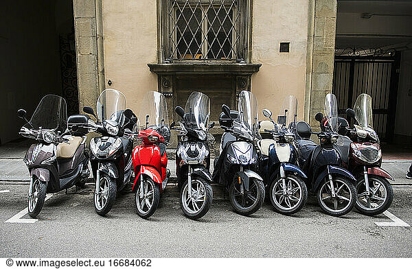 Row of scooters parked in Florence