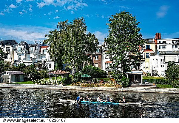 Rowing boat with recreational athletes on the Alster in Hamburg Winterhude  Hamburg  Germany  Europe