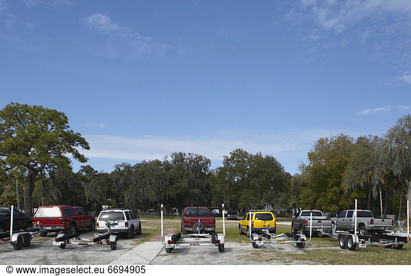 Rows of Vehicles With Boat Trailers