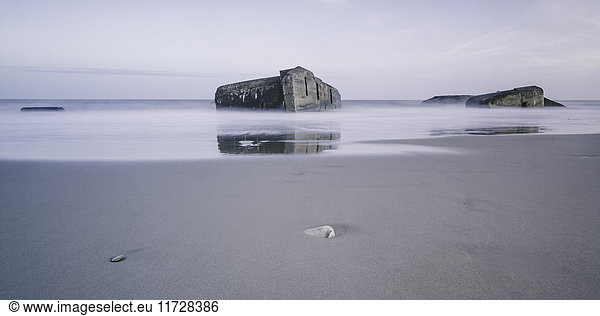 Ruins in tranquil ocean at low tide  Vigsoe  Denmark