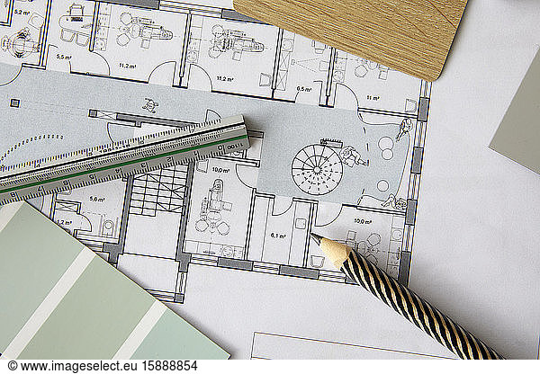 Ruler and pencil lying on architectural blueprint