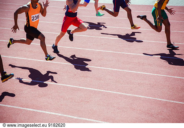 Runners racing on track