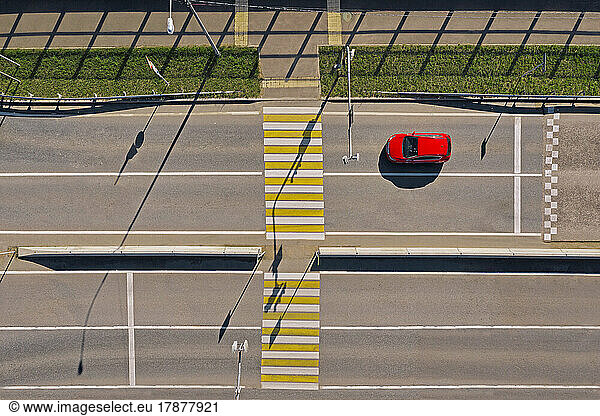 Russia  Aerial view of single car in front of empty zebra crossing