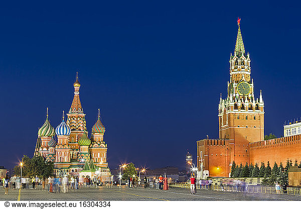 Russia  Central Russia  Moscow  Red Square  Saint Basil's Cathedral Kremlin wall and Spasskaya Tower in the evening