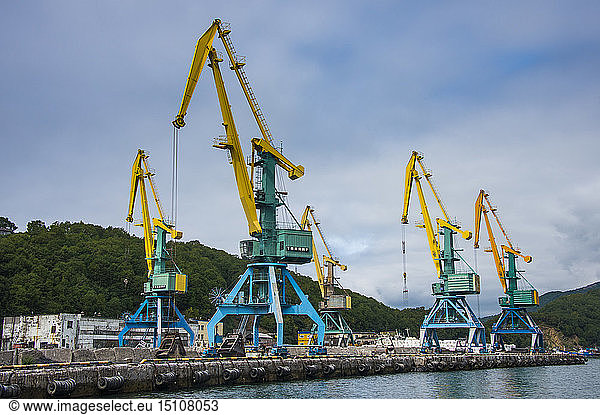 Russia  Kamchatka  Petropavlovsk-Kamchatsky  loading cranes in the habour