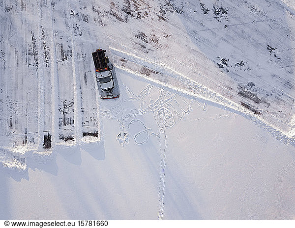 Russia  Leningrad Oblast  Tikhvin  Aerial view of snowplow clearing parking lot