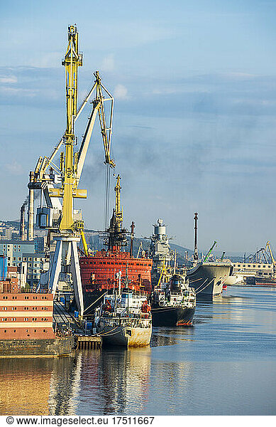 Russia  Murmansk  Industrial ships and cranes at dock