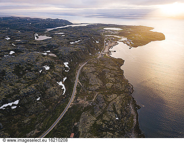 Russia  Murmansk Oblast  Teriberka  Aerial view of coastal road at sunset