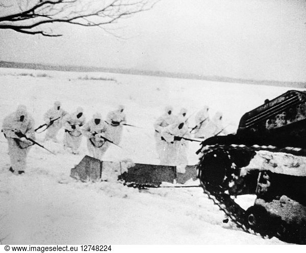 RUSSO-FINNISH WAR  1939-40. Soviet snow fighters advance behind a tank which tows an armored sled into which they can duck when caught in fire from the Finnish line  1939-40.