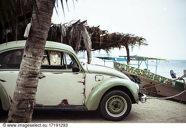 Rustic beetle Volkswagen on Pacific Ocean beach Mazunte Mexico