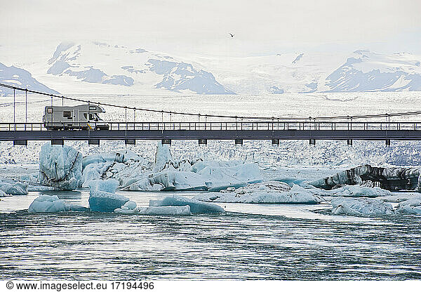 RV driving on suspension bridge over the glacier lagoon Jökulsárlón