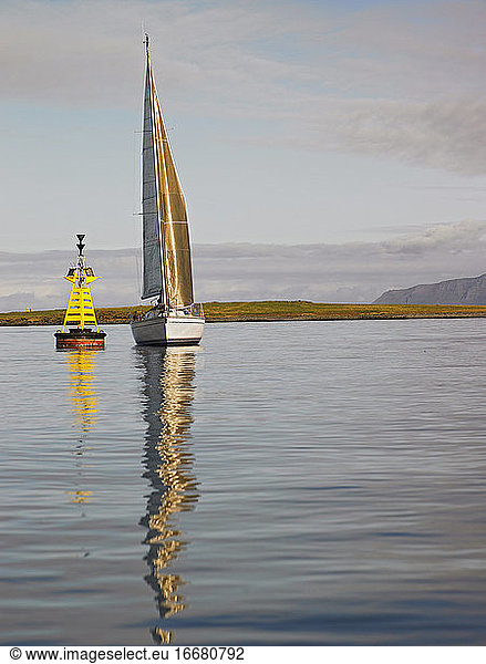 sailboat in calm weather close to Reykjavik