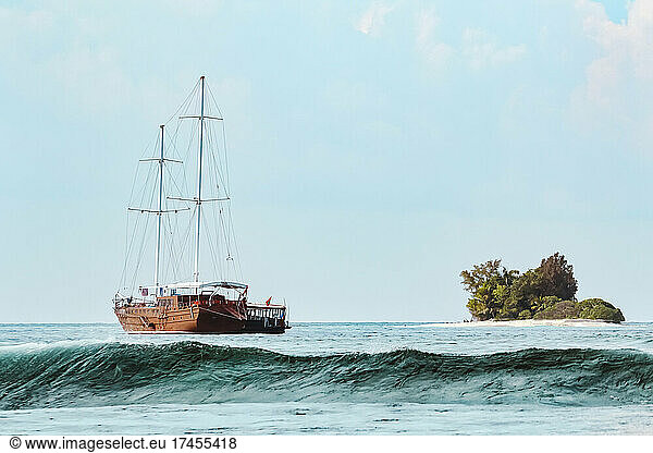 Sailing yacht and small island